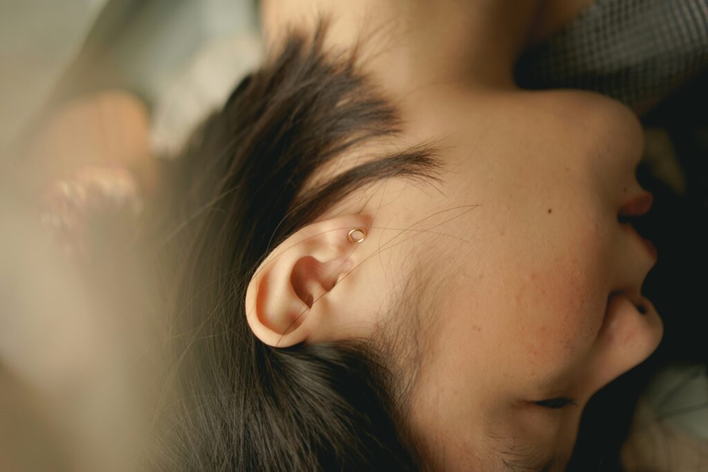 Why Is My Earwax Dark? covering earwax color, aging wax, buildup, environmental exposure, infections, cleaning habits, and ear health.